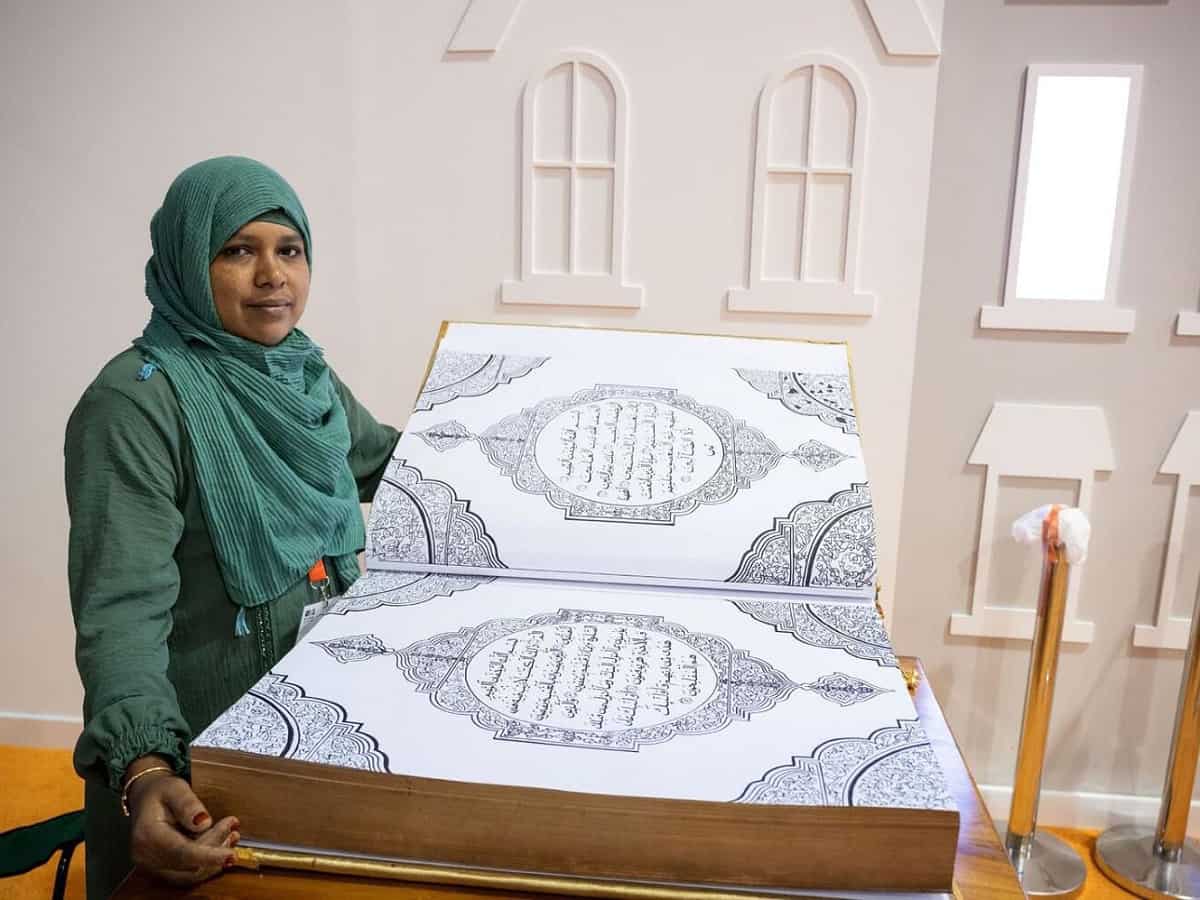 Indian woman handwritten Quran T5fvPF