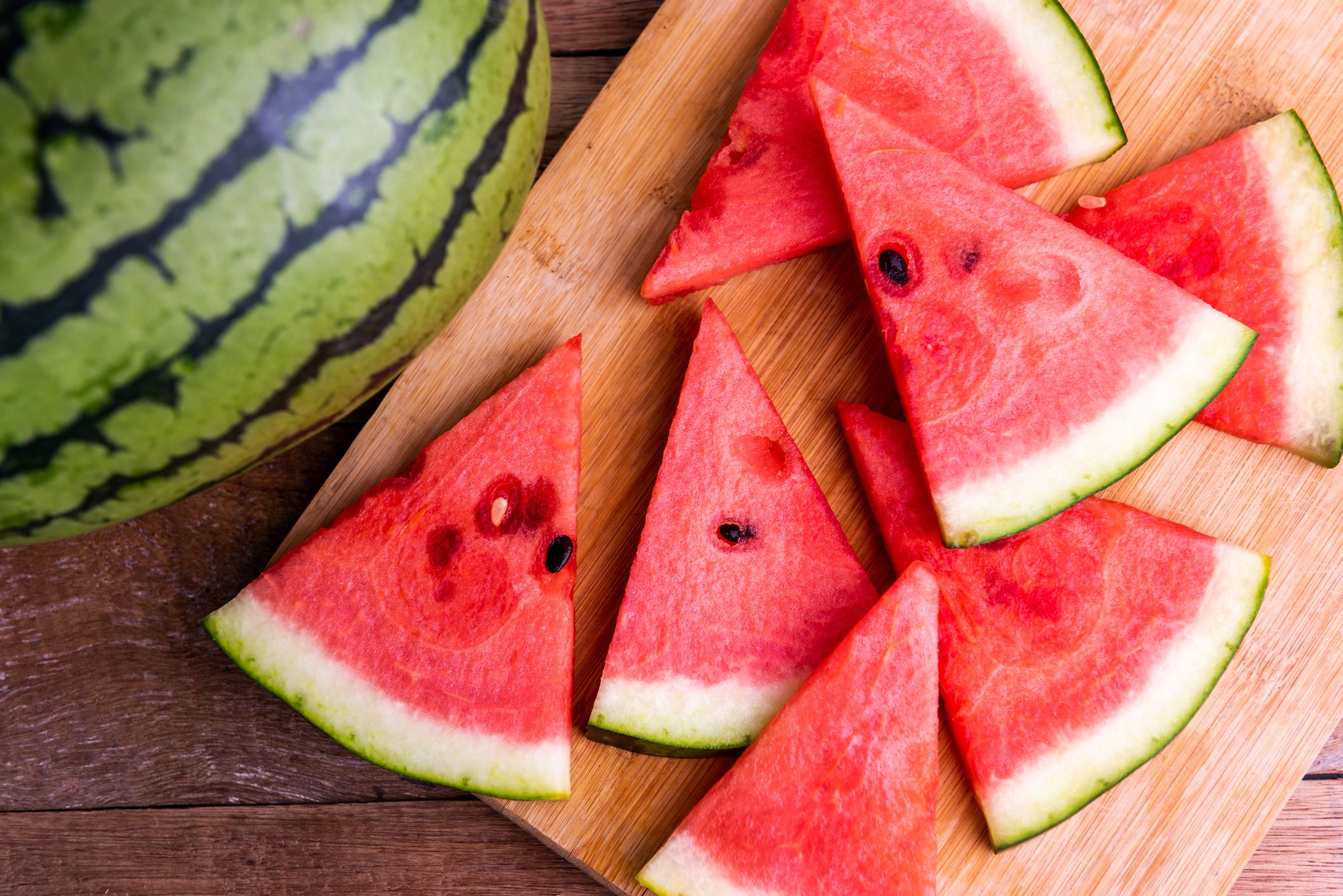 fresh ripe watermelon slices on wooden table royalty free image 1684966820 1
